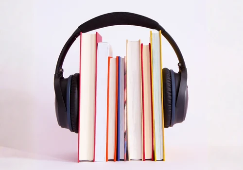 Headphones and books representing audio learning